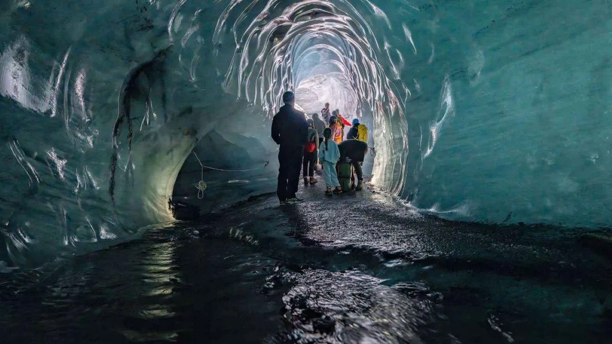 Minibus group crossing Mýrdalssandur towards Kötlujökull on a Katla ice cave and south coast day tour from Reykjavík, Iceland
